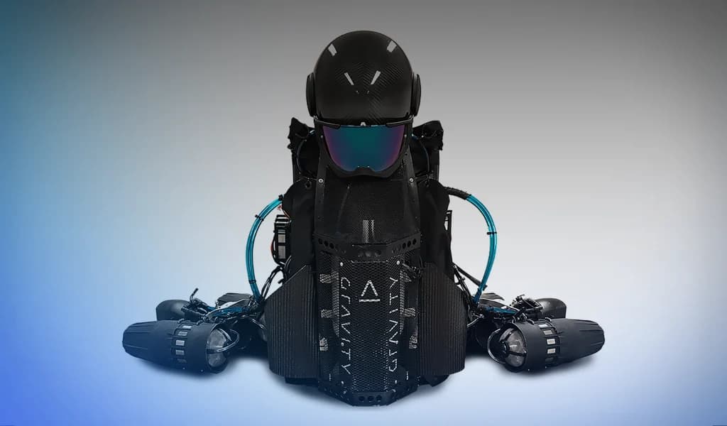 Front view of a Gravity Industries jet suit showing helmet, chest unit, and arm-mounted thrusters.