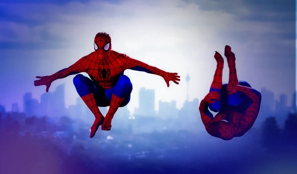 Two people dressed as Spider-Man performing flips against a city skyline backdrop.