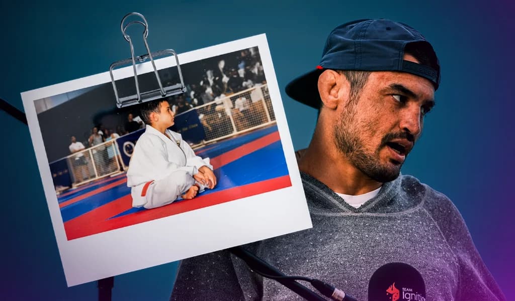 Kron Gracie speaking into a Team Ignition microphone next to a Polaroid photo of himself as a young boy in a white gi sitting on a competition mat.