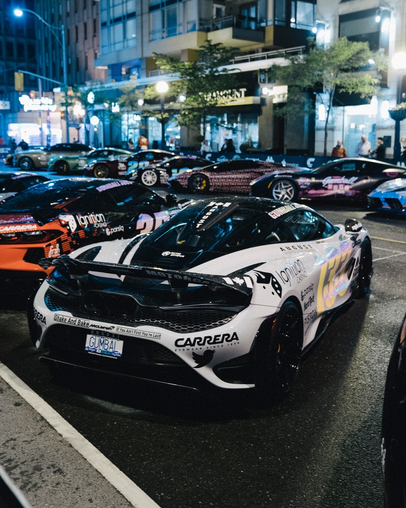 Gumball 3000 cars parked at night