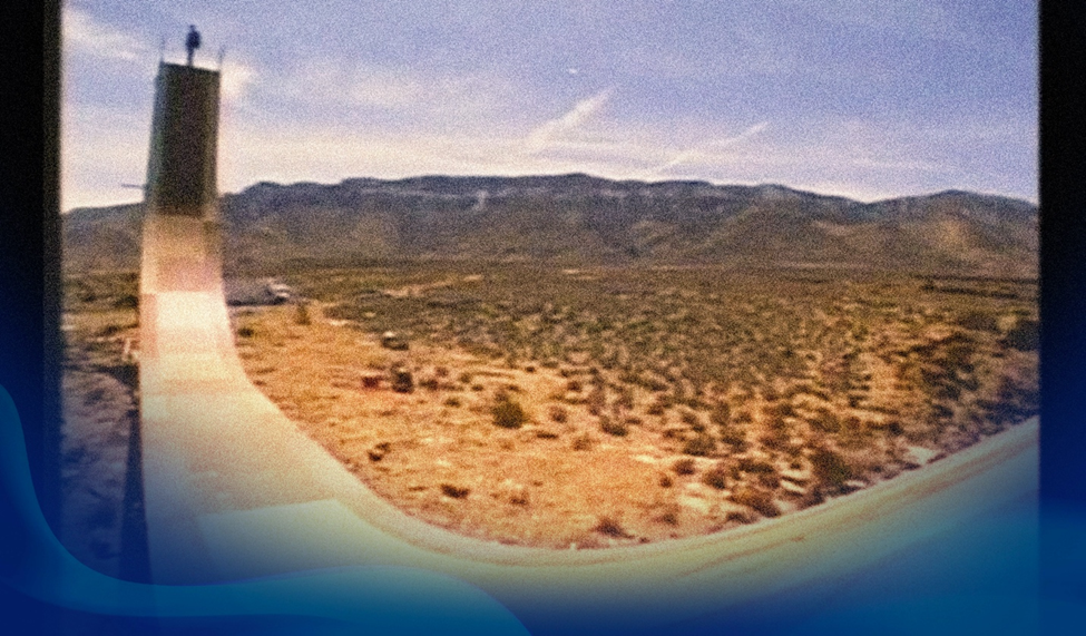 Image of Bob Burnquist at the top of a ramp set against the vast Grand Canyon landscape.