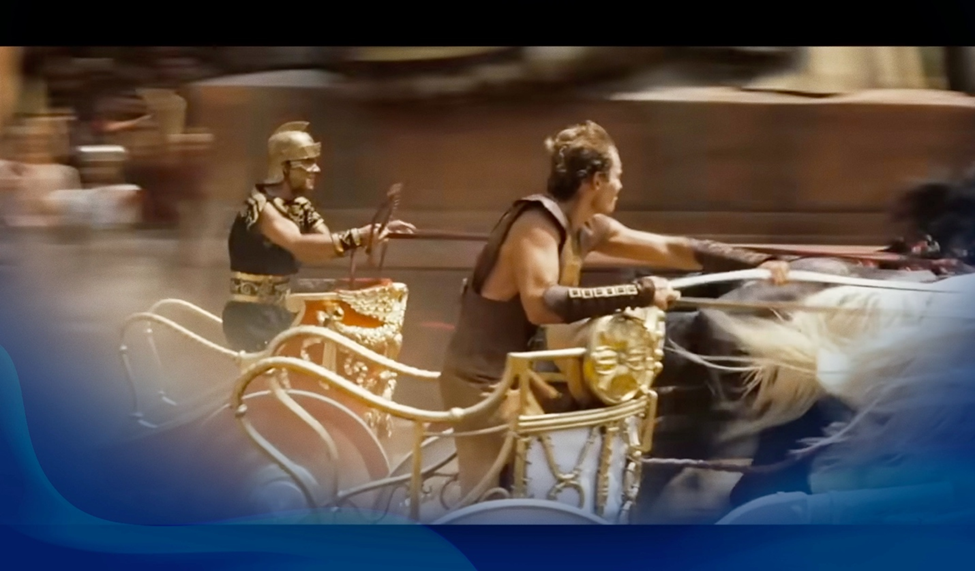 Two racers in a chariot race, one in gold armor and the other in brown, racing through an ancient Roman-style arena.