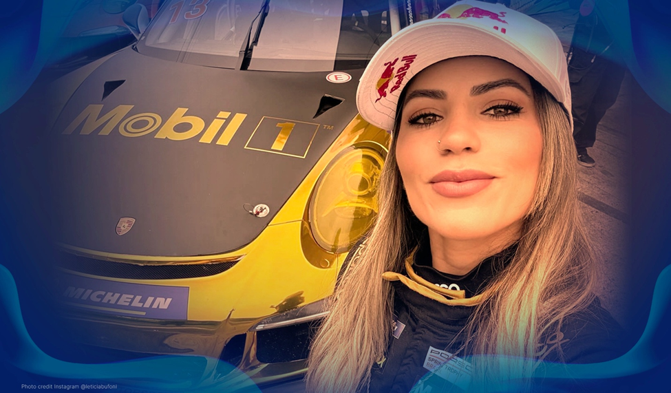 Close-up of Leticia Bufoni posing in front of a gold-liveried Mobil 1 race car, wearing a racing suit and a Red Bull cap.